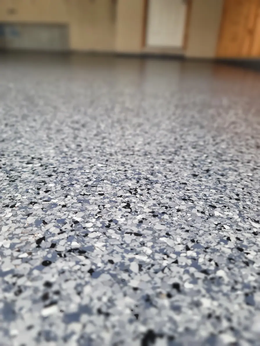 Local residential epoxy flooring project with warm grey finish