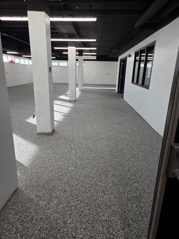 High-end epoxy floor installation with premium custom finish