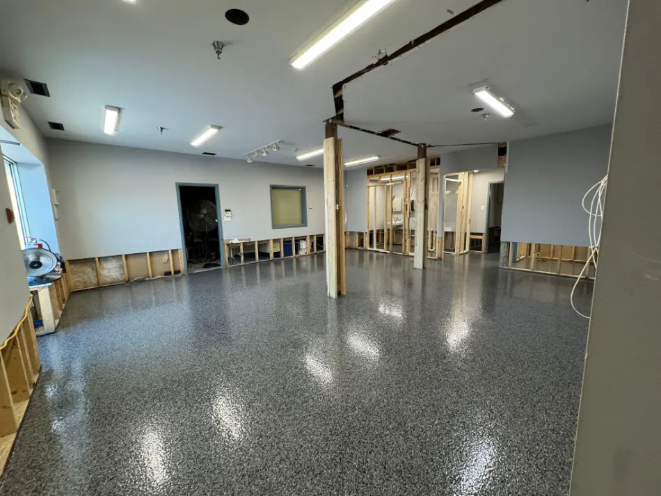 Broadcast flake epoxy floor with speckled finish for garages or basements